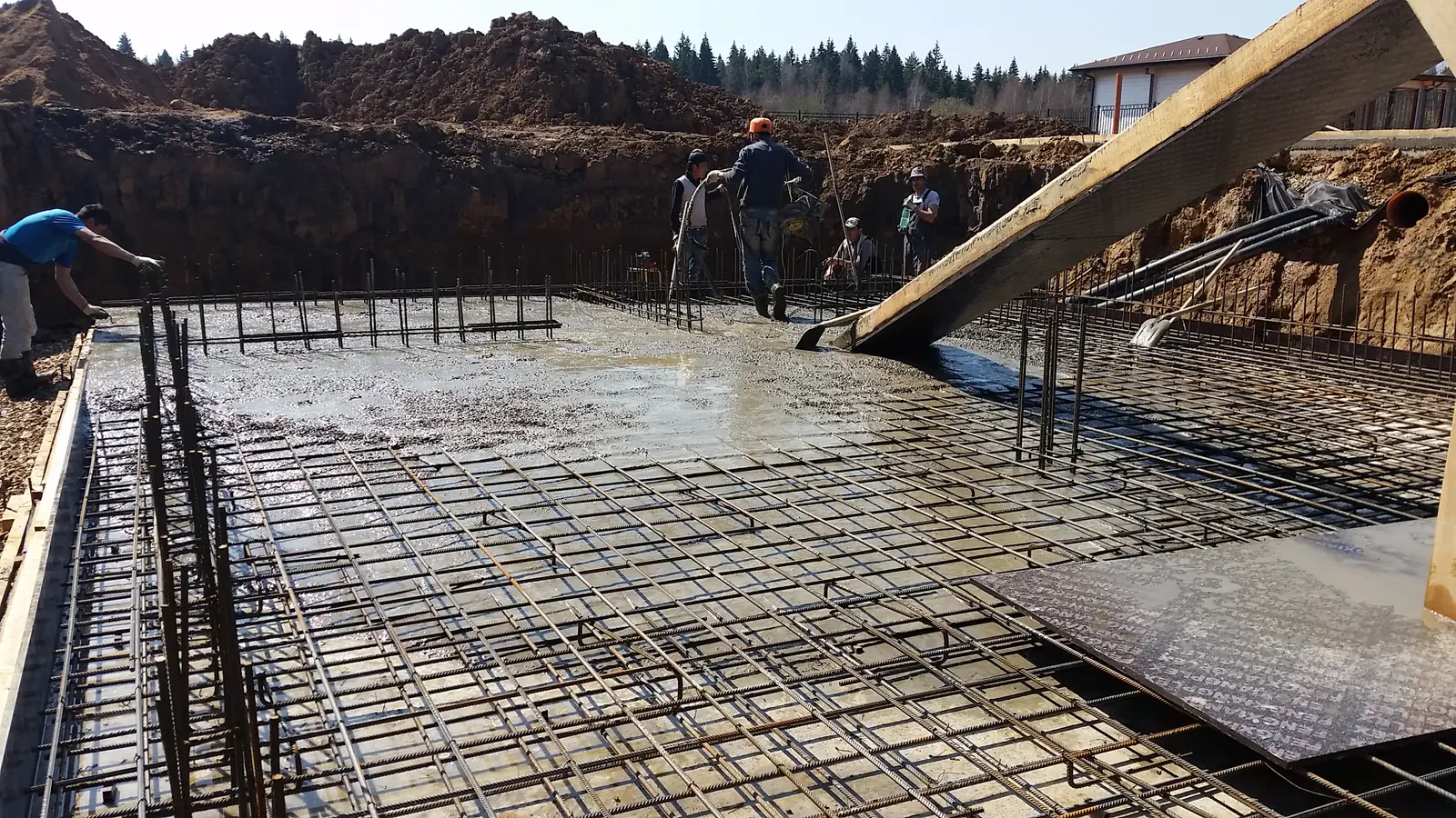 Reinforcement cage of the foundation slab — photographed before the concrete pour