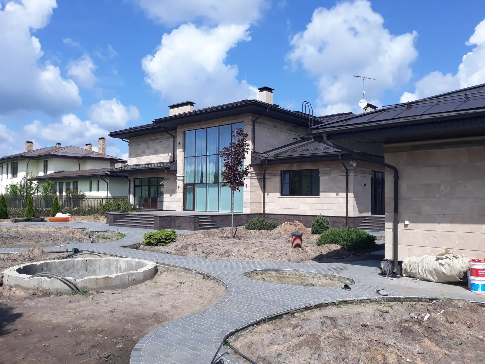 The finished home: paving and planting, with final landscaping under way